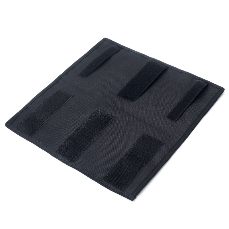 Back of the black visor organizer showing its hook-and-loop mounting straps
