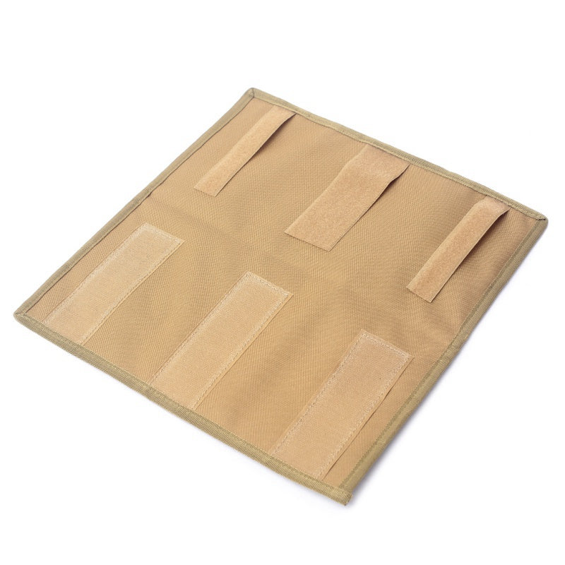 Back of the tan visor organizer showing its hook-and-loop mounting straps