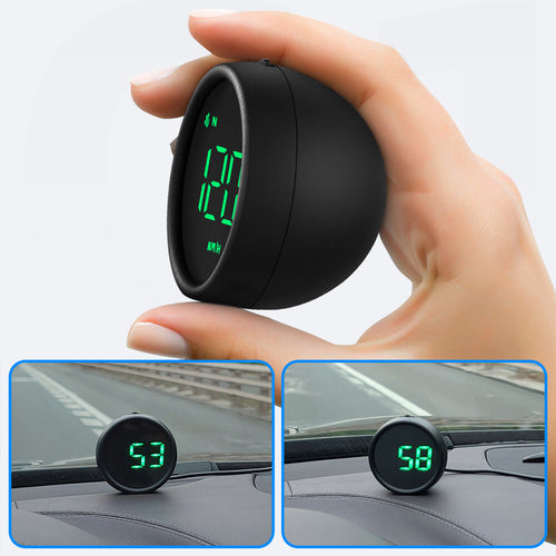 Hand holding the round HUD unit switched on, showing a green speed readout